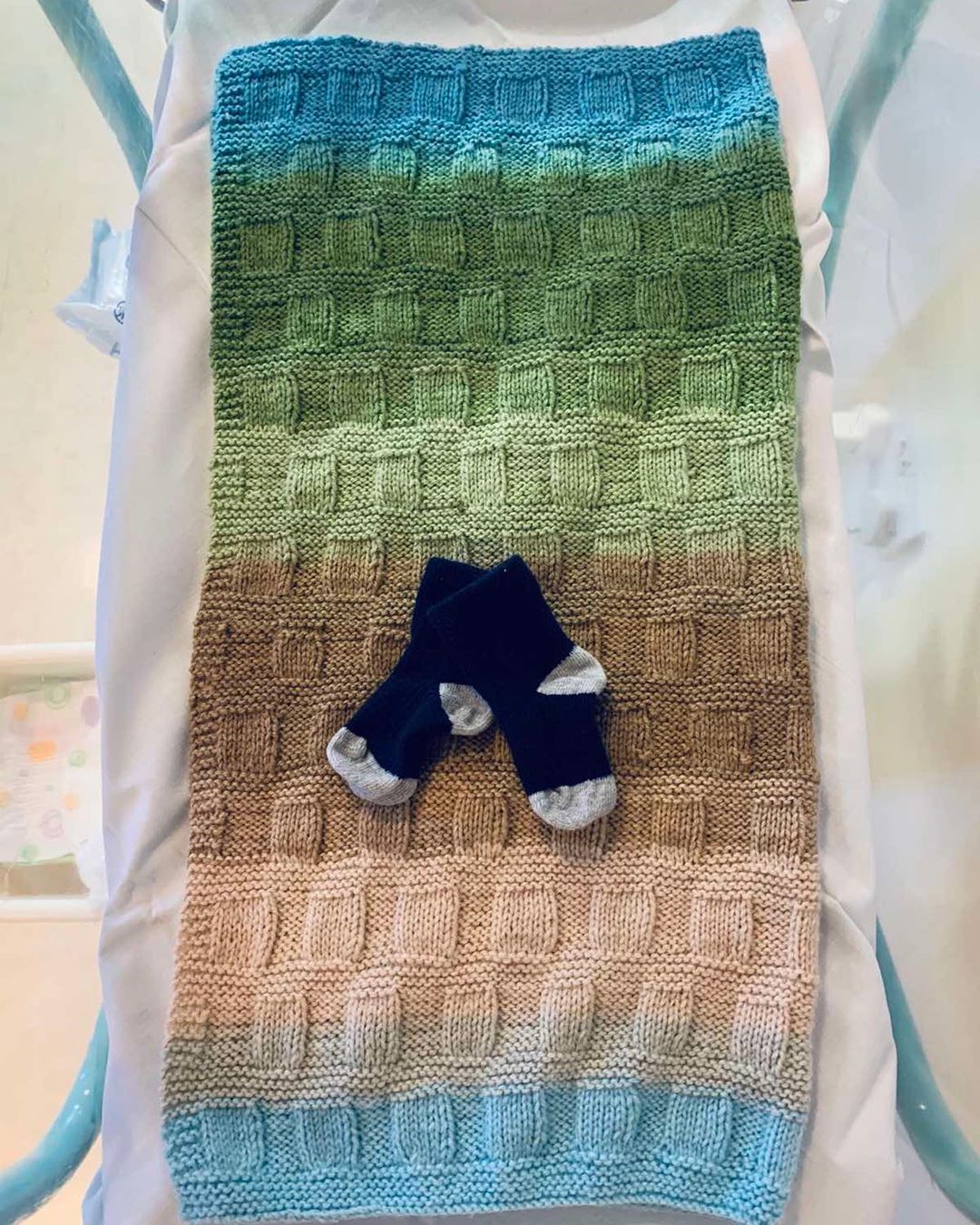 picture of baby blanket and baby socks